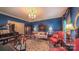 Elegant living room featuring a chandelier, stylish furniture, and a sophisticated color scheme for refined living at 1240 Fawn Ridge Nw Rd, Concord, NC 28027