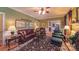 Comfortable living room with classic furnishings, decorative artwork, and a seamless transition to the dining area at 1240 Fawn Ridge Nw Rd, Concord, NC 28027