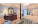 Elegantly designed main bedroom features a four-poster bed, hardwood floors, and a stylish dresser at 1240 Fawn Ridge Nw Rd, Concord, NC 28027
