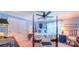 Serene bedroom with a four-poster bed, soft blue walls, and ample natural light, creating a relaxing retreat at 1240 Fawn Ridge Nw Rd, Concord, NC 28027