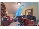 Office with a large desk, comfortable chair, computer setup, and overhead lighting at 1240 Fawn Ridge Nw Rd, Concord, NC 28027