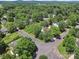 Neighborhood aerial view showcases the home's location on a tree-lined street with well-kept landscaping at 1252 Winding Path Rd, Lake Wylie, SC 29710