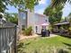 Backyard features a patio with grill and seating, lush green grass and a privacy fence at 1252 Winding Path Rd, Lake Wylie, SC 29710