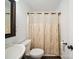 Cozy bathroom featuring a neutral shower curtain, classic toilet, and bright vanity at 1252 Winding Path Rd, Lake Wylie, SC 29710