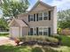 Charming two-story home with beautiful landscaping, attached garage, and inviting front entrance at 1252 Winding Path Rd, Lake Wylie, SC 29710
