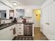 Updated kitchen featuring granite countertops, stainless steel appliances, and white cabinets at 1252 Winding Path Rd, Lake Wylie, SC 29710