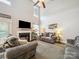 Spacious living room featuring a fireplace, neutral-toned sofas, and ample natural light at 1252 Winding Path Rd, Lake Wylie, SC 29710