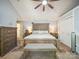 Serene bedroom with a wooden bed frame, neutral walls, and plenty of closet space at 1252 Winding Path Rd, Lake Wylie, SC 29710