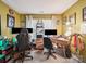 Home office featuring dual monitors, two desk chairs, comfortable seating, and large windows at 1252 Winding Path Rd, Lake Wylie, SC 29710