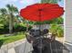 Outdoor patio area features a dining table with red umbrella, making it the perfect spot for entertaining at 1252 Winding Path Rd, Lake Wylie, SC 29710
