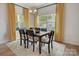 Cozy dining room featuring a wooden table, seating for six, and bright natural light at 1254 Langston Ln, Salisbury, NC 28144
