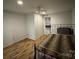 Comfortable bedroom with wood floors, ceiling fan, and large window at 128 Pine St, Shelby, NC 28152