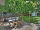 Charming backyard with dining set, ideal for outdoor meals and gatherings in a serene setting at 1325 Kennon St, Charlotte, NC 28205