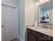 Cozy half bathroom with granite countertops and natural light, providing a convenient space at 1325 Kennon St, Charlotte, NC 28205