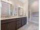 Bathroom featuring dual vanities, dark wood cabinets, and updated fixtures at 1325 Kennon St, Charlotte, NC 28205