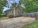 Home featuring a driveway with ample parking space and well-maintained landscaping around the perimeter of the home at 1325 Kennon St, Charlotte, NC 28205