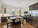 Well-lit kitchen features stainless appliances, granite countertops, and an island with seating at 1325 Kennon St, Charlotte, NC 28205