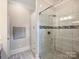 Modern bathroom shower featuring glass door and elegant tile design, providing a luxurious spa-like experience at 1325 Kennon St, Charlotte, NC 28205