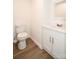 Powder room with updated fixtures and modern vanity and commode at 1406 Caldwell St, Gastonia, NC 28052