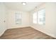 Bright bedroom offers natural light and features modern flooring and neutral paint at 1406 Caldwell St, Gastonia, NC 28052