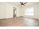 A bedroom featuring new floors, fresh paint, and bright natural light from large windows at 1406 Caldwell St, Gastonia, NC 28052