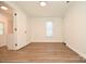 Bright bedroom has modern wood-look floors and ample natural light from the window at 1406 Caldwell St, Gastonia, NC 28052
