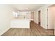 Bright kitchen featuring new flooring, fresh paint, and modern white cabinets and countertops at 1406 Caldwell St, Gastonia, NC 28052