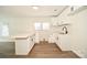 Bright kitchen features white cabinets, modern hardware, and a breakfast bar at 1406 Caldwell St, Gastonia, NC 28052