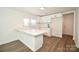 Bright kitchen featuring new flooring, fresh paint, and modern white cabinets and countertops at 1406 Caldwell St, Gastonia, NC 28052