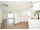 Open kitchen boasts white cabinets, a breakfast bar, and updated appliances at 1406 Caldwell St, Gastonia, NC 28052