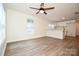 Open-concept living space with new flooring and fresh paint adjoins the kitchen, creating a welcoming atmosphere at 1406 Caldwell St, Gastonia, NC 28052