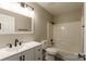 Bathroom features a white vanity with modern black fixtures and a shower-tub combination at 142 Single Oak Dr, Troutman, NC 28166