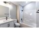 Updated bathroom features a sleek vanity, modern fixtures, and a shower-tub combo at 142 Single Oak Dr, Troutman, NC 28166