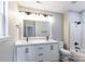 Bright bathroom boasts a double sink vanity and shower-tub combination at 142 Single Oak Dr, Troutman, NC 28166