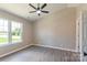 Bedroom with neutral walls, carpet flooring, and a window view at 142 Single Oak Dr, Troutman, NC 28166