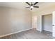 Bright bedroom with a modern ceiling fan, gray vinyl floors, and fresh neutral paint at 142 Single Oak Dr, Troutman, NC 28166