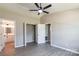 Bedroom with double door closet, fresh paint, and view into ensuite bath at 142 Single Oak Dr, Troutman, NC 28166