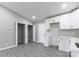Spacious room featuring an open closet and white kitchen cabinets at 142 Single Oak Dr, Troutman, NC 28166
