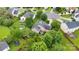Aerial view of a home with a large backyard, shed and deck, surrounded by mature trees at 15248 Pangborn Pl, Charlotte, NC 28278