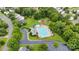 Aerial view of a community pool surrounded by mature trees and lounge chairs for relaxing at 15248 Pangborn Pl, Charlotte, NC 28278