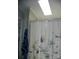 Well-lit bathroom featuring a floral shower curtain and neutral wall paint at 166 Eagle Dr, New London, NC 28127