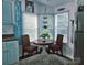 Bright breakfast nook with round table, woven chairs, and bay windows at 166 Eagle Dr, New London, NC 28127
