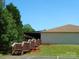 Building with wooden stairs leading to an elevated walkway with ample parking at 166 Eagle Dr, New London, NC 28127