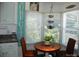 The dining nook with bright sunlight and an ornamental plant offers a relaxing ambiance in the kitchen at 166 Eagle Dr, New London, NC 28127