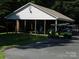 Community pavilion with picnic tables, golf carts, and shade trees at 166 Eagle Dr, New London, NC 28127