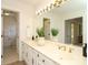 Bathroom offers a double vanity, classic fixtures, and a connecting door leading to the adjacent room at 1928 Providence Rd, Charlotte, NC 28211