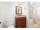 Bathroom with granite counters, wooden vanity, and shower at 1928 Providence Rd, Charlotte, NC 28211