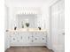 Bathroom features a double vanity, ample lighting, and white cabinetry offering a clean, functional space at 1928 Providence Rd, Charlotte, NC 28211