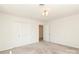 Neutral bedroom features a large closet and access to other rooms at 1928 Providence Rd, Charlotte, NC 28211