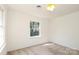 Bright bedroom with neutral walls and carpet at 1928 Providence Rd, Charlotte, NC 28211